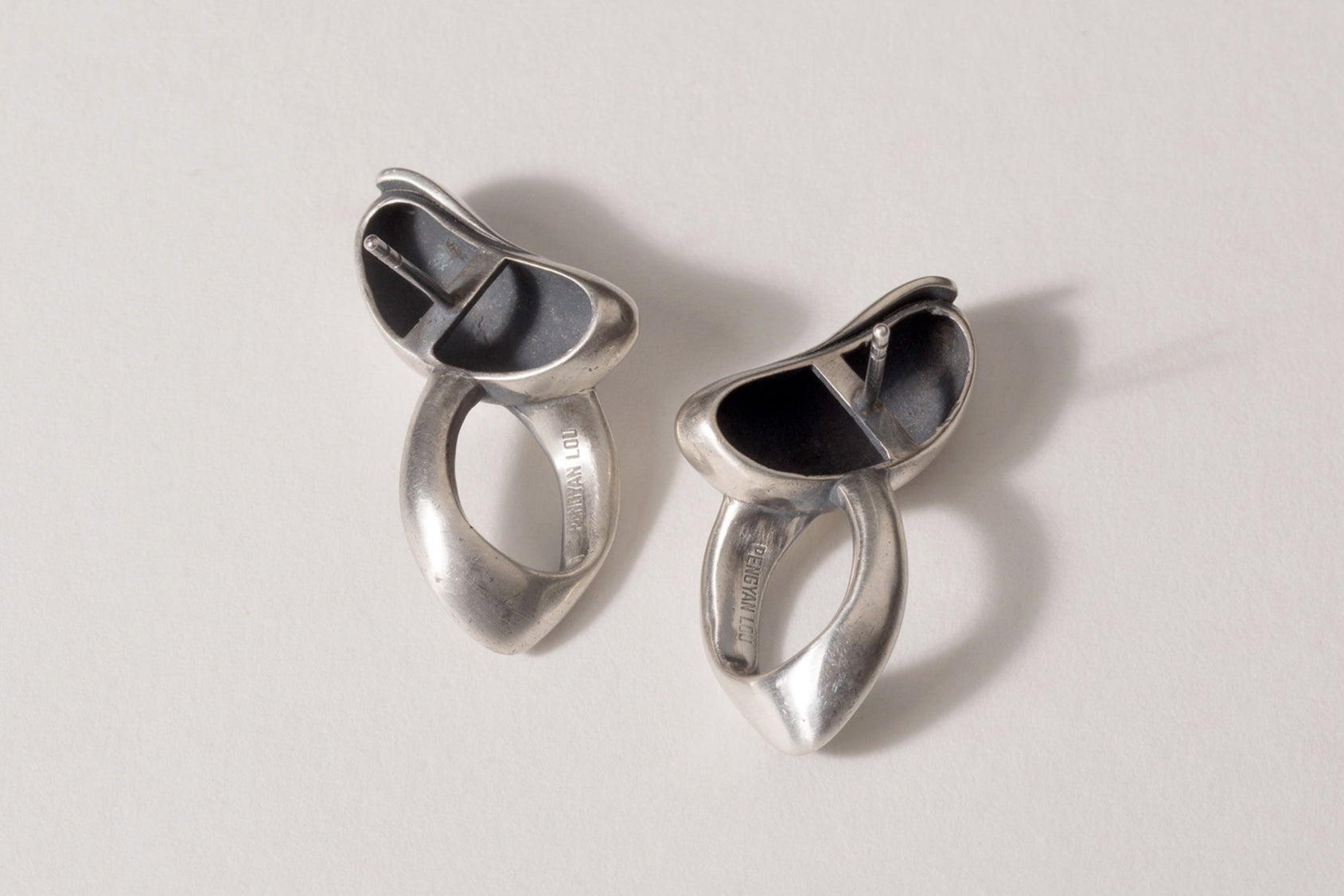 TWISTED CUT-OUT OVAL EARRINGS